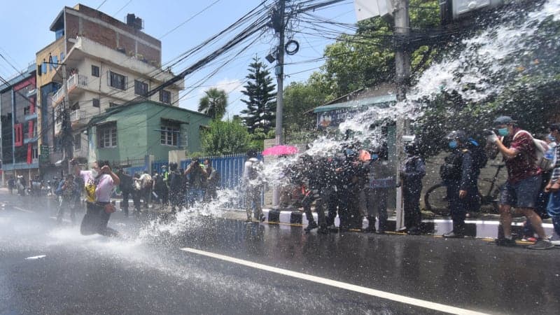 Protesters brought under control using water cannon